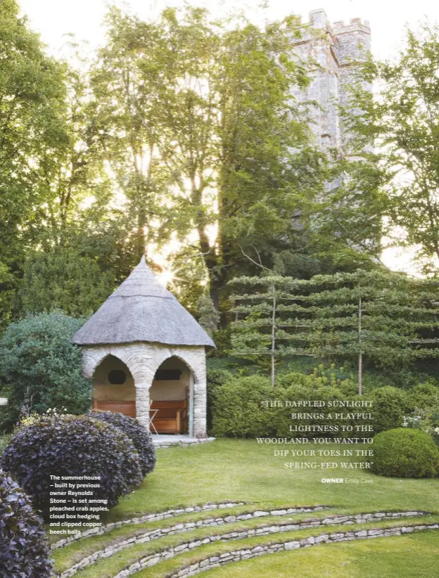  ??  ?? The summerhous­e – built by previous owner Reynolds Stone – is set among pleached crab apples, cloud box hedging and clipped copper beech balls