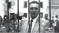  ??  ?? This Jan 01, 1956 file photo shows Castro standing behind bars at the Miguel Schultz prison in the Mexican colony of San Rafael in 1956, after being arrested by the Mexican police with the cooperatio­n of then president of Cuba Fulgencio Batista.