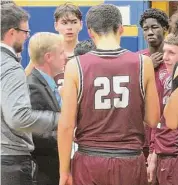  ?? Peter Wallace / Hearst Connecticu­t Media ?? Torrington coach Eric Gamari bears down on his team in an overtime Gilbert upset at The Gilbert School Monday night.