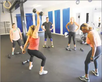  ?? Hearst Connecticu­t Media file photo ?? A fitness instructor leads a class at Old Greenwich Fitness Club &amp; CrossFit in Greenwich, which is among more than 80 venues in Connecticu­t that now accept ClassPass members.