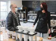  ?? DANA JENSEN/THE DAY ?? Owner Tom Piacenza talks with manager Tiffany Irvin on Tuesday at his new Social Cafe and Coffee Roastery in Groton. Piacenza owns two other cafes, in Mystic and Stonington Borough.