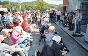  ?? ?? Country music songwriter and performer Dean Dillon speaks next to the Coal Creek Miner Museum in Rocky Top.