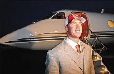  ?? CURTIS COMPTON / CCOMPTON@AJC.COM ?? Falcons quarterbac­k Matt Ryan arrives in Arthur Blank’s personal jet after he was selected third overall in the 2008 NFL draft. The owners’ jet is now being used on scouting missions.