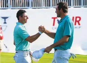  ?? STEVE HELBER AP ?? Scottie Scheffler (right) goes into Tour Championsh­ip as No. 1 seed and a two-shot lead but lost a four-shot lead in the final round to Rory McIlroy (left) last season in Atlanta.