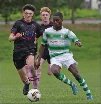  ??  ?? Wexford’s Brody Murphy taking on Martins Olakanye of Shamrock Rovers.