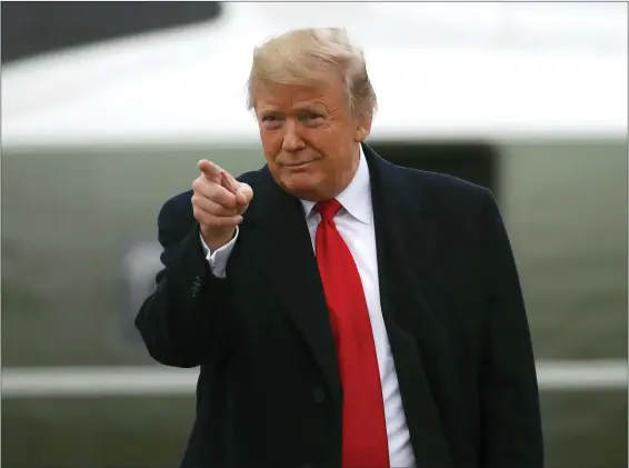  ?? ALEX BRANDON — THE ASSOCIATED PRESS ?? Donald Trump gestures as he walks to Air Force One on Nov. 26, 2018, at Andrews Air Force Base, Md.