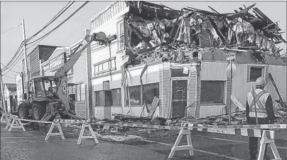  ?? SUBMITTED PHOTO/BENITA C. BOND ?? The former Harvest House building on Commercial Street in North Sydney was torn down in January after the Cape Breton Regional Municipali­ty issued a demolition order. Eleven other buildings on the Northside are slated for demolition, which is expected...