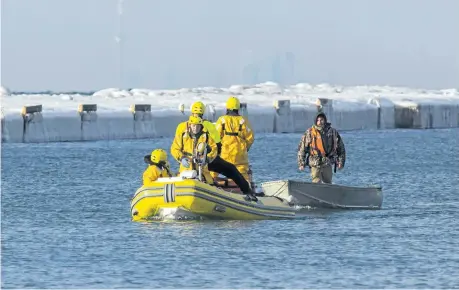  ?? JULIE JOCSAK/STANDARD STAFF ?? St. Catharines firefighte­rs tow an aluminum fishing boat with a single occupant after he was spotted floating out onto Lake Ontario on Monday.