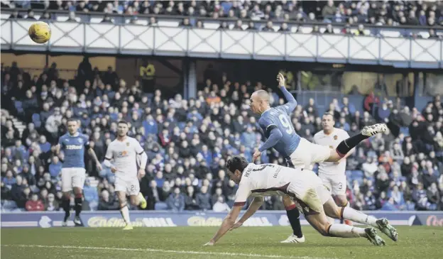 ?? PICTURE: ROB CASEY/SNS ?? 0 Kenny Miller takes to the air to draw Rangers level in their Scottish Cup comeback and keep afloat hopes of a first major trophy in six years.