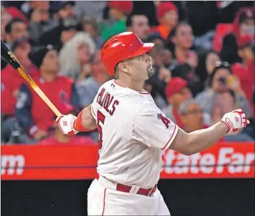  ?? Wally Skalij Los Angeles Times ?? ALBERT PUJOLS hits a home run in the first inning. He is two hits shy of 3,000, and could join Hank Aaron, Willie Mays and Alex Rodriguez as the only players in history with 600 home runs and 3,000 hits.