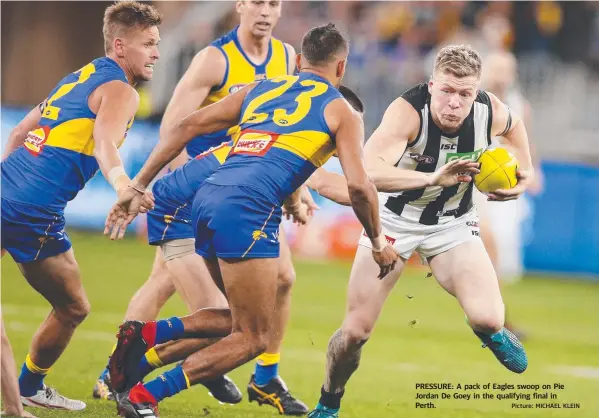  ?? Picture: MICHAEL KLEIN ?? PRESSURE: A pack of Eagles swoop on Pie Jordan De Goey in the qualifying final in Perth.