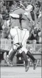  ?? Ted Kirk
Associated Press ?? VIRGINIA CATCHER Matt Thaiss and reliever Nathan Kirby celebrate winning national title.