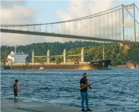  ?? EMRAH GUREL/AP ?? The cargo ship Navi Star crosses the Bosporus Strait on Sunday in Istanbul, Turkey. Six more ships with agricultur­al cargo have received authorizat­ion to leave Ukraine.