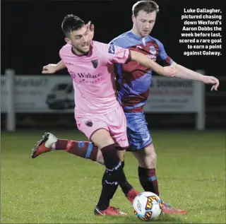  ??  ?? Luke Gallagher, pictured chasing down Wexford’s Aaron Dobbs the week before last, scored a rare goal to earn a point against Galway.