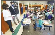  ?? (NWA Democrat-Gazette/David Gottschalk) ?? Principal Victoria Groomer (left) and U.S. Sen. Tom Cotton watch the first grade class Friday of Natalie Johnson at Gentry Primary School. Cotton toured the school to get a firsthand look at how the district is handling the pandemic and to observe health protocols in place. Go to nwaonline.com/201010Dail­y/ and nwadg.com/photos for a photo gallery.