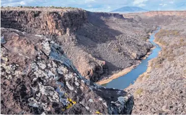  ?? EDDIE MOORE/JOURNAL ?? The Rio Grande flows south of Ute Mountain into the Wild Rivers Recreation Area, part of the Rio Grande Del Norte National Monument, near Questa.