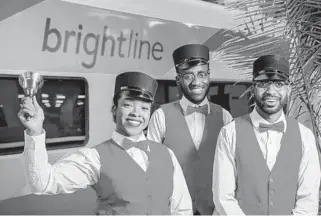  ?? GUY RHODES/COURTESY ?? Cast members of The Polar Express Train Ride, produced by Rail Events Production­s, greet passengers on the Brightline train in Fort Lauderdale last November.