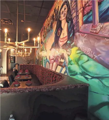 ?? STU BOYD II-THE COMMERCIAL APPEAL ?? Villa Castrioti opens its second location in The Lake District in Lakeland. A mural by “Alivepaint” is on the wall of the dining area.