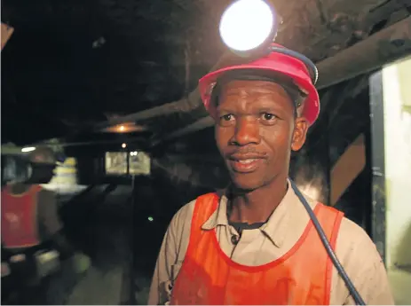  ?? /Antonio Muchave ?? On safe ground: A miner at Beatrix gold mine near Welkom returns to the surface after being stuck undergroun­d after a power cut last week. There was no cause for alarm, but the media made the most of the situation and portrayed it as a mining disaster.