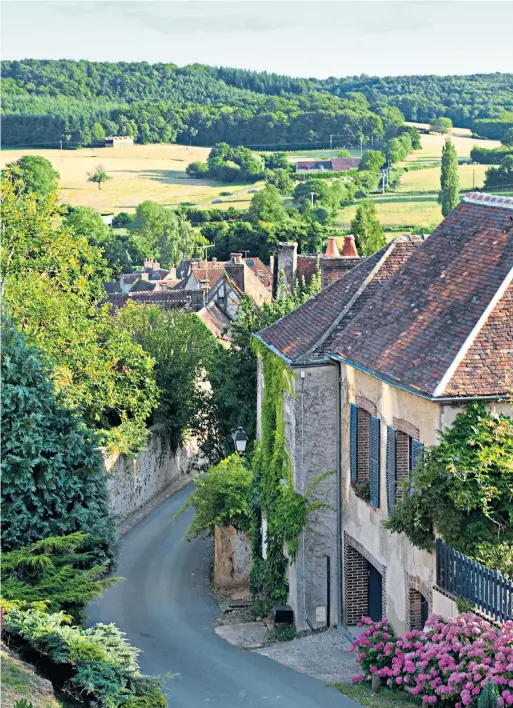  ?? ?? Thé, s’il vous plaît? This tea room in Bellême is perfect for open-air dining
You’ll be hooked: embrace the rural idyll – and slow down – with a few hours of languid fishing iVillages like Moutiers-au-Perche ‘are doubtless more charming now’ than in their working days