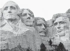  ?? David Zalubowski / Associated Press ?? Mount Rushmore monument, which features the faces of George Washington, Thomas Jefferson, Theodore Roosebelt and Abraham Lincoln, was the idea of South Dakota official hoping to attract tourists to the state.