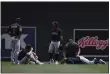  ?? STACY BENGS — THE ASSOCIATED PRESS ?? Josh Naylor lies on the ground with a member of the Indians medical staff after colliding with Ernie Clement on June 27 in Minneapoli­s.