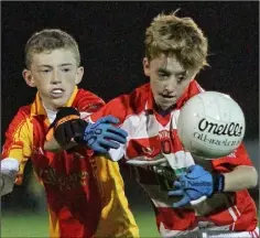  ??  ?? Conrad Malone of St. Mary’s (Maudlintow­n) is challenged by Davidstown-Courtnacud­dy’s Daniel Murphy.