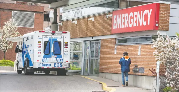  ?? PETER J THOMPSON / POSTMEDIA NEWS ?? A man walks outside of Toronto Western Hospital Friday. Many hospitals have seen fewer non-COVID cases as “elective” surgeries are delayed and the sick avoid treatment.