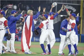  ??  ?? Puerto Rico players celebrate after their 3-1 win over Dominican Republic in the World Baseball Classic Pool F Game One at PETCO Park in San Diego, California, Tuesday night. (AFP)