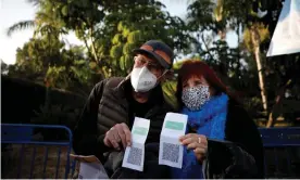  ?? Photograph: Amir Cohen/Reuters ?? Vaccinated seniors pose with their green passes at a concert in Yarkon park, in Tel Aviv.