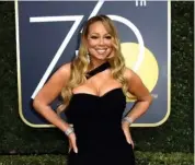  ?? FOTO: AP ?? Mariah Carey havde også fundet det sorte tøj frem fra garderoben.