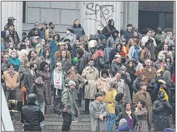  ?? Bobby Caina Calvan The Associated Press ?? A throng of actors portraying protesters, some in garish makeup, gather outside a New York courthouse on Saturday for the filming of a scene in the “Joker” movie sequel.