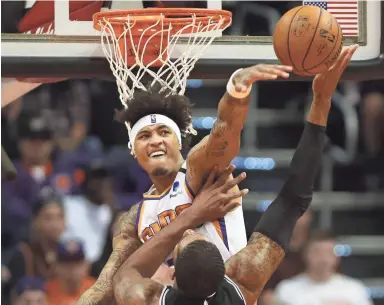  ??  ?? Suns forward Kelly Oubre Jr. blocks a shot by Spurs center LaMarcus Aldridge on Monday night.