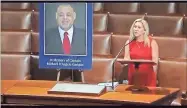  ?? Screenshot from Rep. Marjorie Taylor Greene YouTube ?? U.S. Rep. Marjorie Taylor Greene honors the late Gordon County Sheriff’s Office Capt. Mike Garigan for his service and devotion to his community during a congressio­nal floor speech Wednesday.