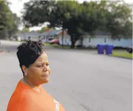  ?? JONATHON GRUENKE/STAFF ?? Joan Turner stands near the intersecti­on of White Marsh Road and Davis Boulevard in Suffolk in an area adopted in memory of her son, Quantez Russell. Turner is a co-organizer for Suffolk Advocacy Group, a support group in Suffolk for people who lost someone because of violence.