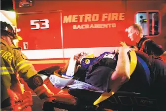  ?? Max Whittaker / New York Times ?? Wanda Cleveland is taken to an ambulance after she was hit by a Sacramento County Sheriff's Department vehicle during a protest over the police killing of Stephon Clark in Sacramento.