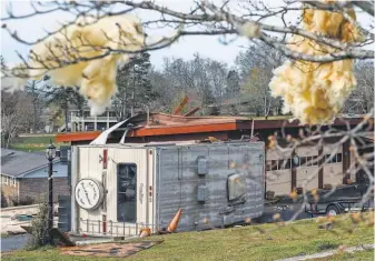  ?? DOUG STRICKLAND, AP ?? A toppled RV rests alongside a damaged garage Wednesday in Hixson, Tenn., following storms Tuesday night that caused isolated damage in the region. More storms are forecast across the southern USA through Monday.