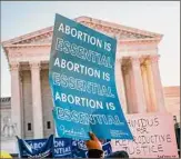  ?? Kent Nishimura / TNS ?? Abortion rights advocates and anti-abortion protesters demonstrat­e in front of the U.S. Supreme Court on Dec. 1.