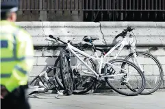  ?? DANIEL LEAL-OLIVAS / AFP / GETTY IMAGES ?? Damaged bicycles from what is being termed a terrorist incident outside the Houses of Parliament in London.