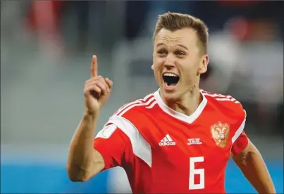  ?? The Associated Press ?? Russia’s Denis Cheryshev celebrates after scoring his team’s second goal against Egypt during a Group A match at the World Cup in St. Petersburg, Russia, on Tuesday. Russia won 3-1.