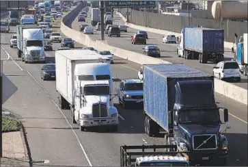  ?? Allen J. Schaben Los Angeles Times ?? BIG RIGS on the 710 Freeway in Long Beach. EPA officials said they would start work to revise truck pollution standards to lower nitrogen oxide emissions while also removing rules industry has complained are costly.