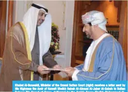  ??  ?? Khaled Al-Bousaidi, Minister of the Omani Sultan Court (right) receives a letter sent by His Highness the Amir of Kuwait Sheikh Sabah Al-Ahmad Al-Jaber Al-Sabah to Sultan Qaboos Bin Saeed of Oman, delivered by the Amir’s Envoy Sheikh Mohammad...