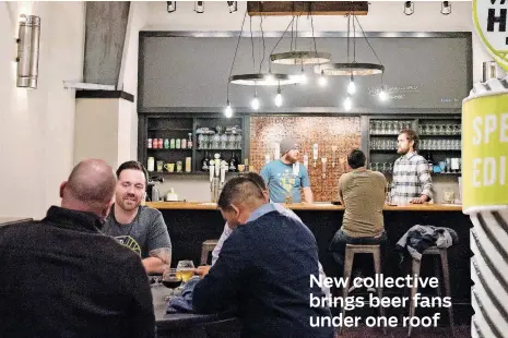  ?? [PHOTOS BY WHITNEY BRYEN, FOR THE OKLAHOMAN] ?? Vanessa House founder Andrew Carrales, left, sits at a table in the Brewers Union taproom, 520 N Meridian Ave., while brewer Evan Smith and Elk Valley brewer Will Perry, right, tend the bar.