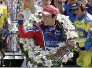  ?? DARRON CUMMINGS — ASSOCIATED PRESS ?? Takuma Sato celebrates winning the Indianapol­is 500 on May 28 at Indianapol­is Motor Speedway.