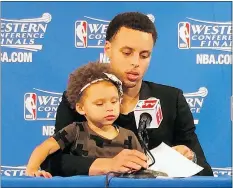  ?? — AP FILES ?? Golden State Warriors’ Stephen Curry sits with his daughter Riley during the post-game news conference after his team’s Game 1 win on Tuesday.