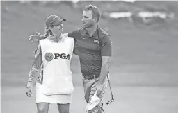  ?? DARREN CARROLL/PGA OF AMERICA ?? Jessie Mueller caddied for her husband Jesse as he won the PGA Profession­al Championsh­ip this week in Austin, Texas.