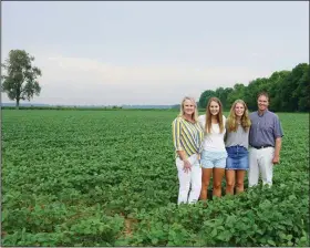  ?? (Special to the Democrat-Gazette) ?? The Render family (from left), Dawn, Mary-Keaton, Stella and Chad, stand in a soybean field on their 6,200-acre Jefferson County farm. The Renders, the Southeast District Farm Family of the Year, also grow corn and rice.