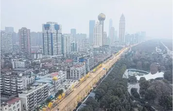  ?? AFP ?? Buildings of Wuhan in China’s central Hubei province, amid a deadly virus outbreak which began in the city.