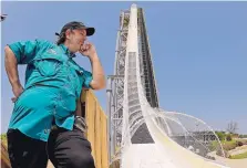  ?? CHARLIE RIEDEL/ASSOCIATED PRESS ?? Ride designer Jeffery Henry looks over his creation, the world’s tallest waterslide called “Verruckt” at Schlitterb­ahn Waterpark in Kansas City, Kansas, in 2014.