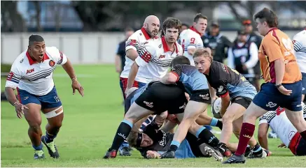  ?? ?? Pirates-Old Boys halfback Josh Murrell clears the ball from a ruck during the Southland premier club rugby fixture against Woodlands in Invercargi­ll on Saturday.